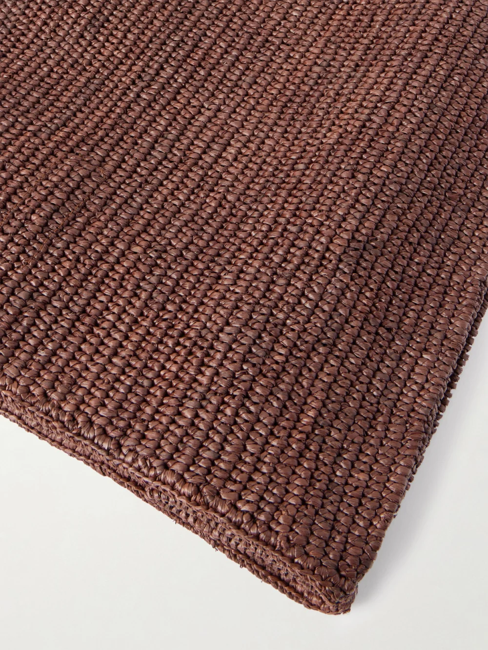 Close-up detail of The Row Loretta Leather and Webbing-trimmed Raffia Tote