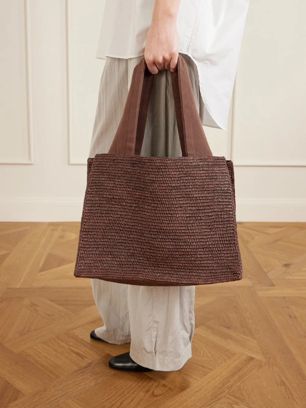 The Row Loretta Leather and Webbing-trimmed Raffia Tote, styled view