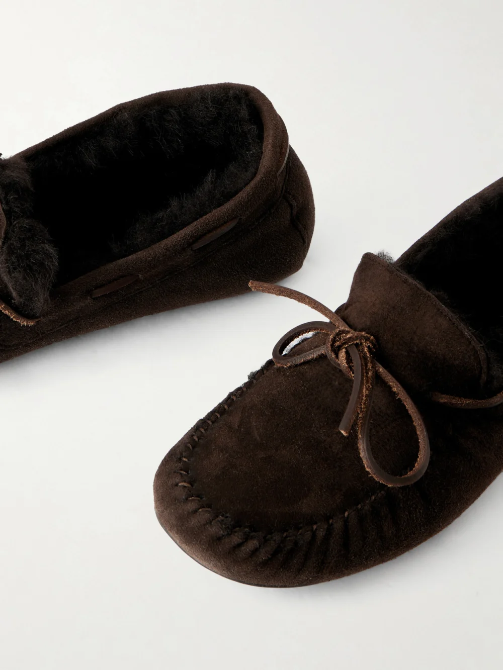 Close-up detail of The Row Lucca Bow-detailed Shearling-lined Suede Loafers