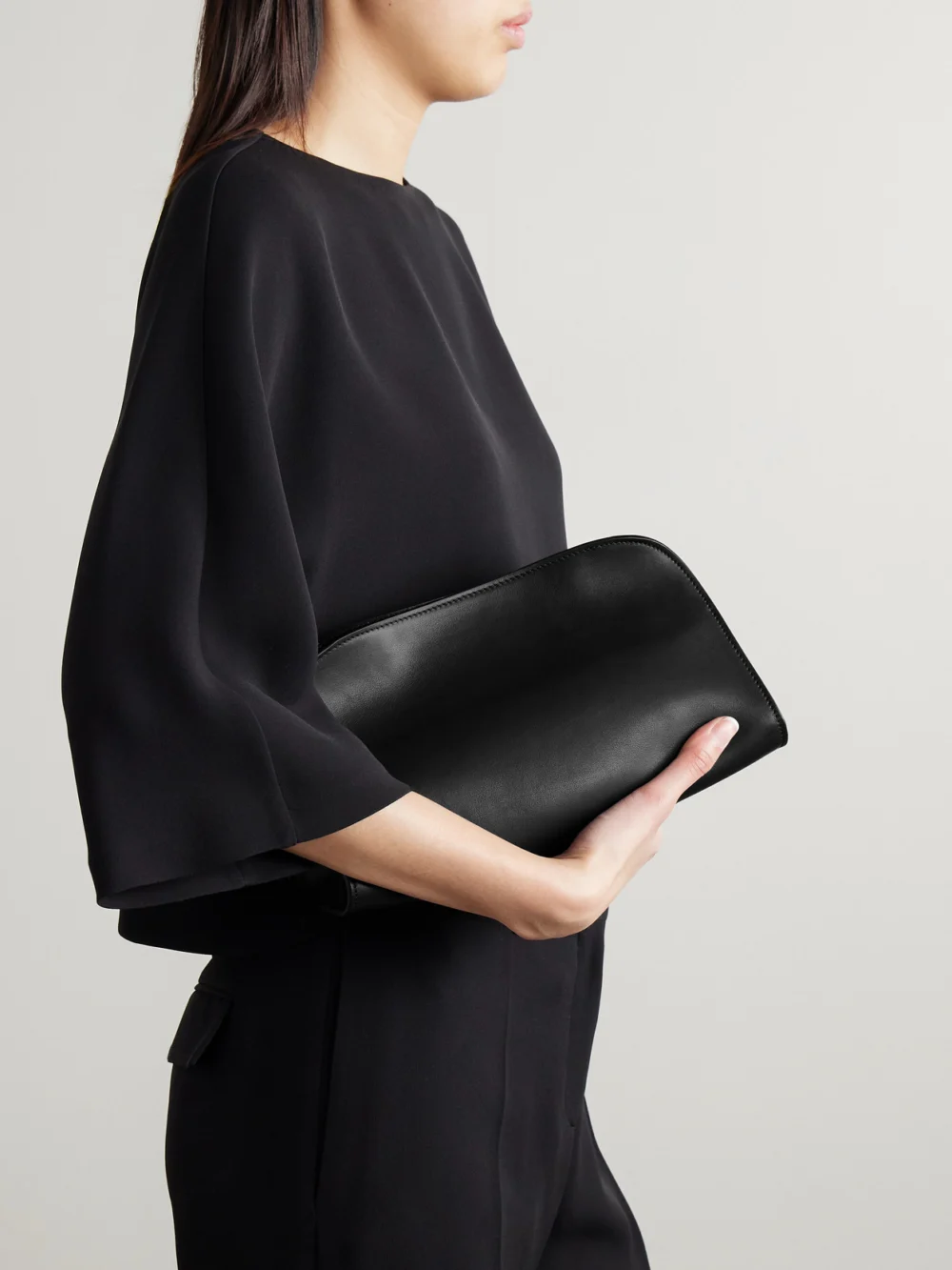 The Row Peggy Leather Clutch, styled view