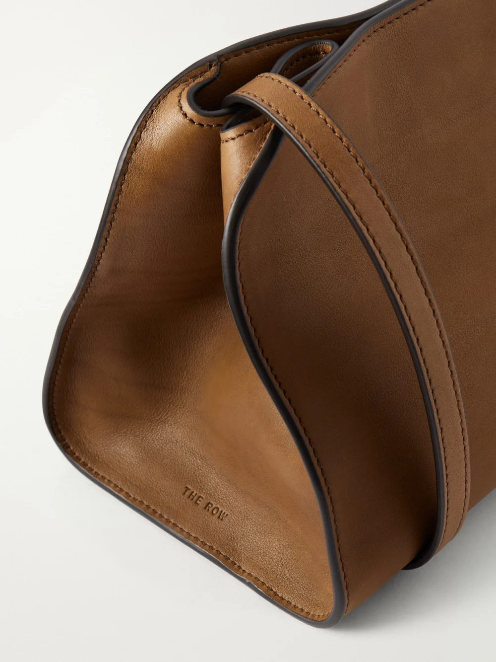Close-up detail of The Row Peggy Leather Clutch