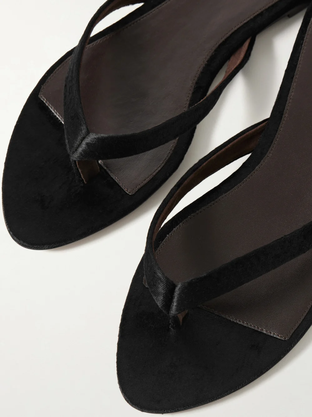Close-up detail of The Row Sacha Flat Thong Velvet Sandals