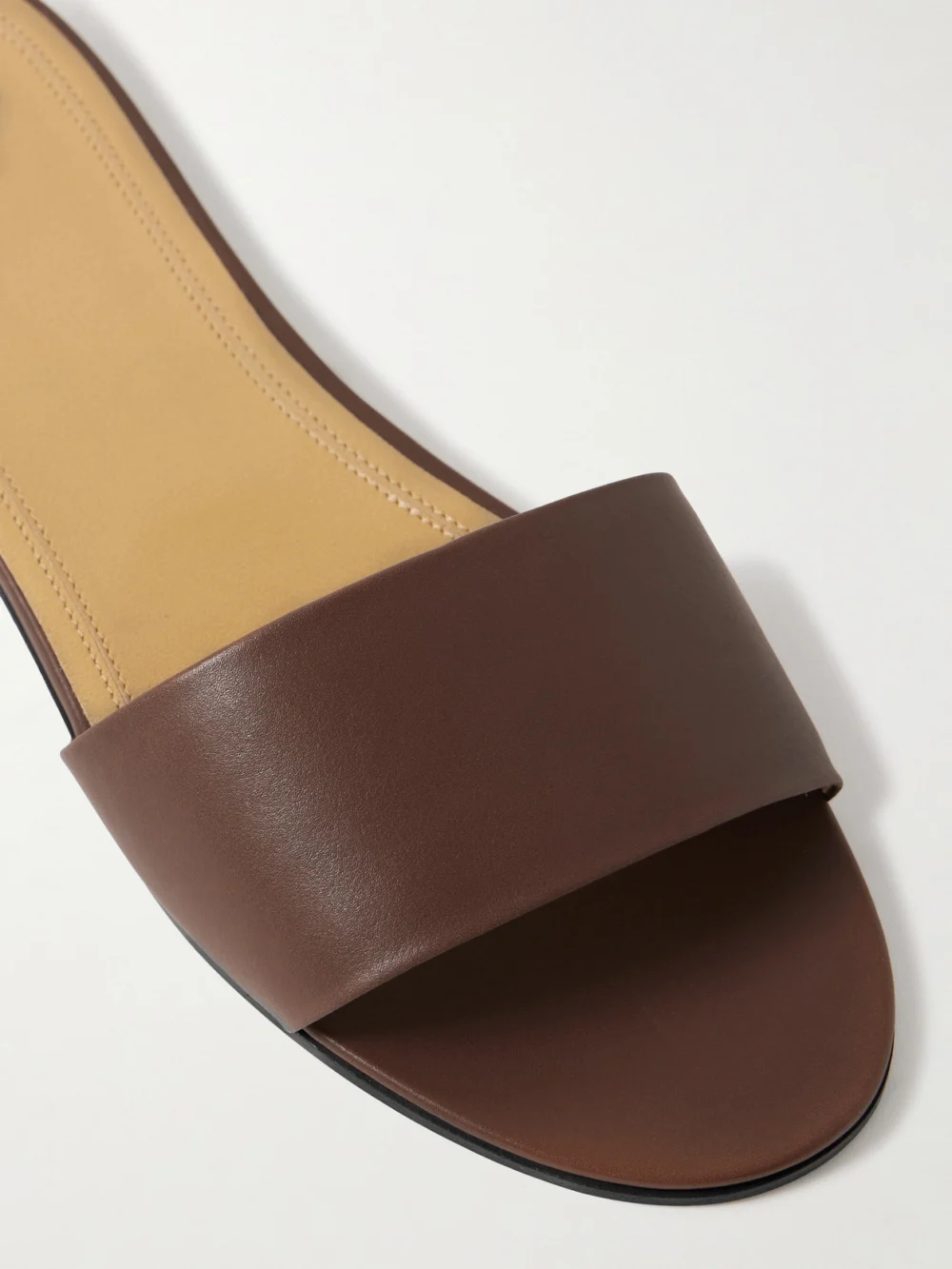 Close-up detail of The Row Signum Leather Slides