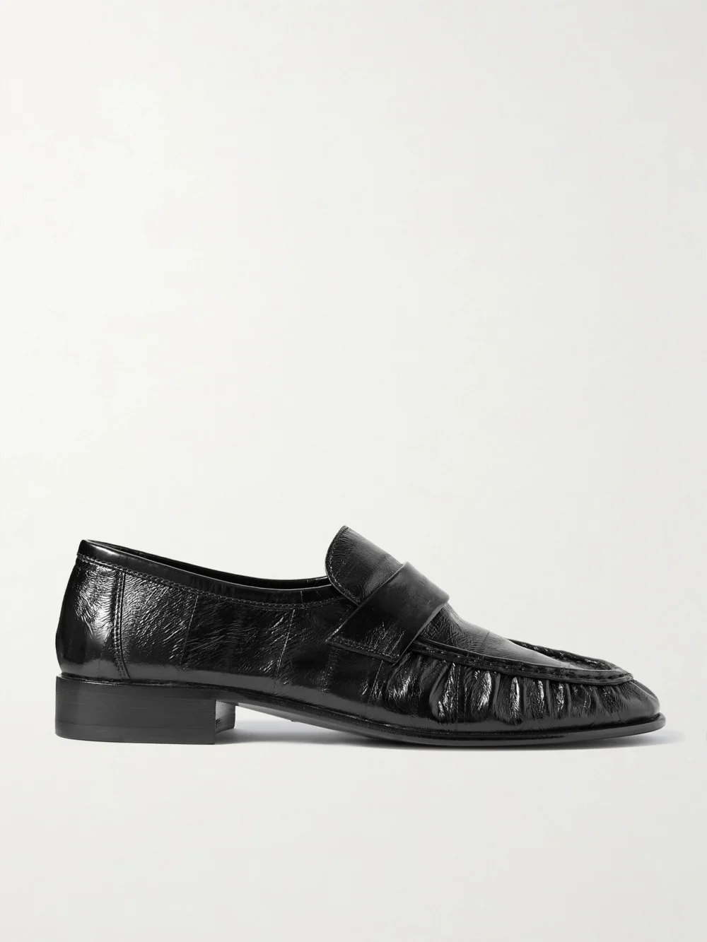 The Row Soft Paneled Glossed-eel Loafers in black