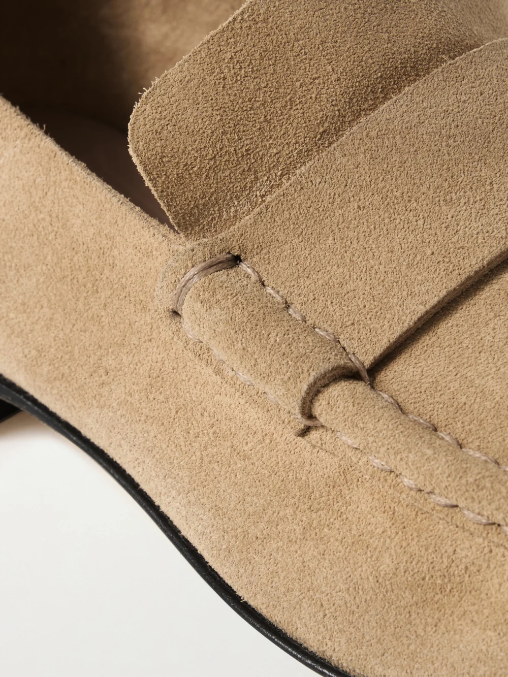 Close-up detail of The Row Soft Suede Loafers