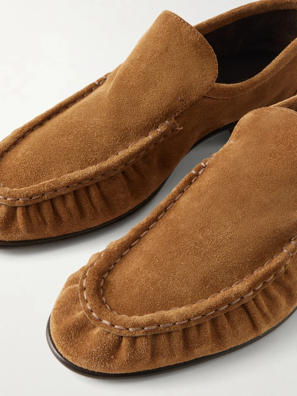 Close-up detail of The Row Soft Suede Loafers