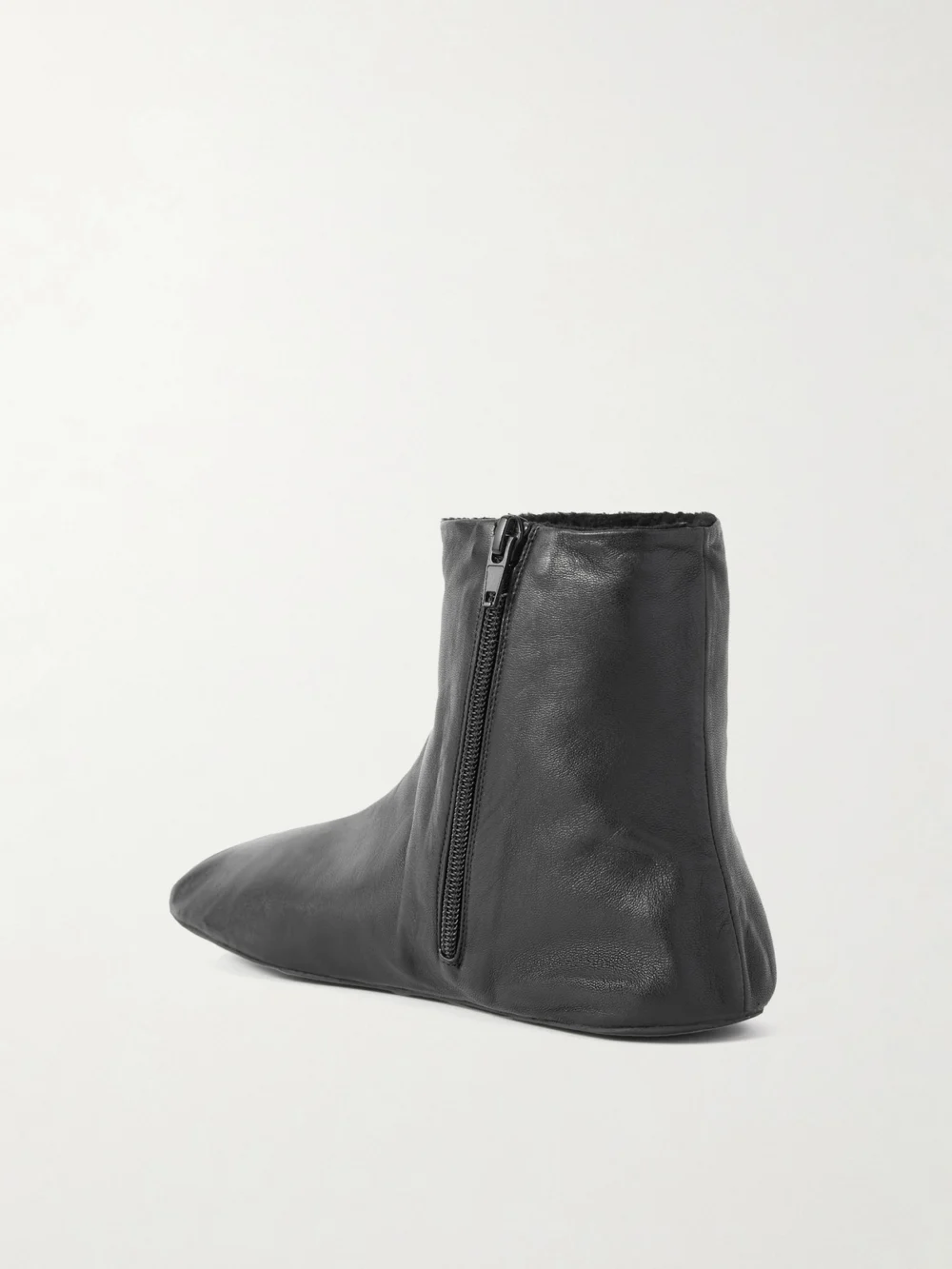 Back view of The Row Stella Leather and Shearling Ankle Boots