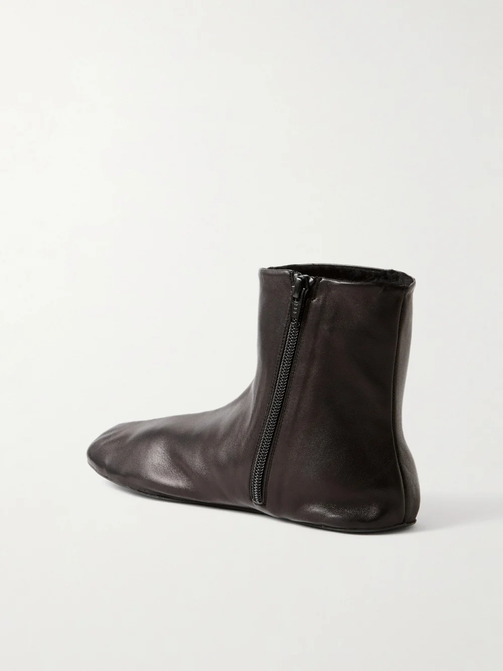 Back view of The Row Stella Leather and Shearling Ankle Boots