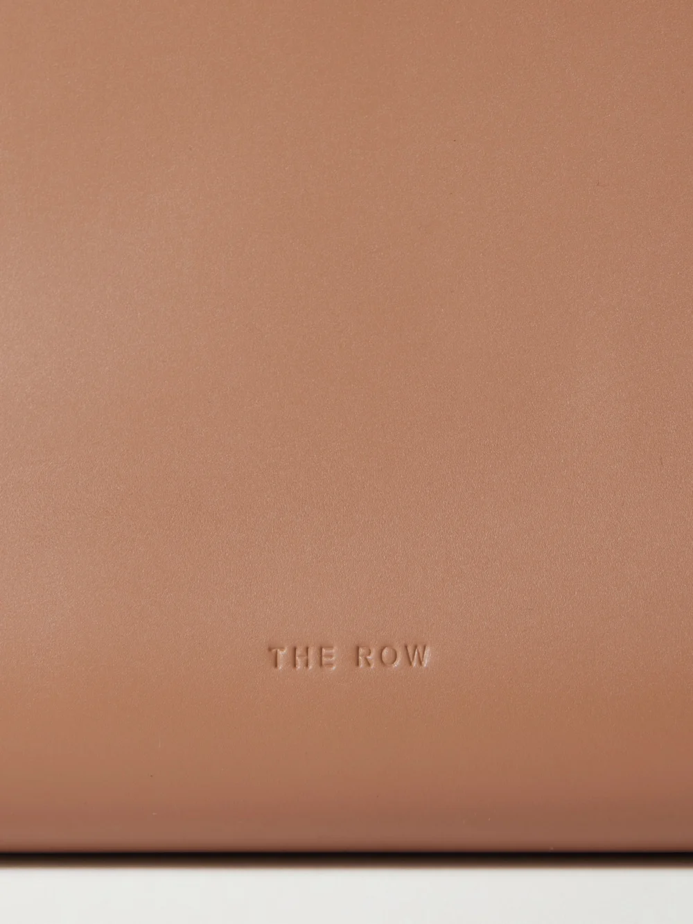 Close-up detail of The Row Sylvia Leather Clutch