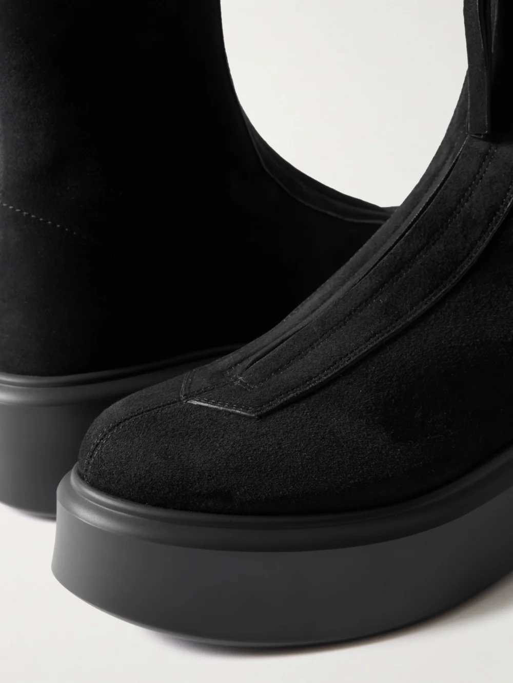 Close-up detail of The Row The Zipped Suede Platform Ankle Boots