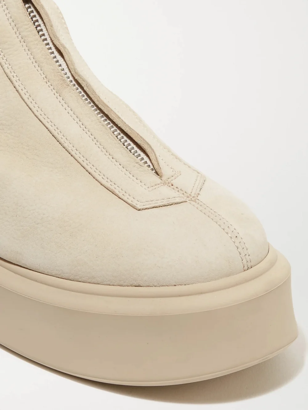 Close-up detail of The Row The Zipped Textured-nubuck Platform Ankle Boots