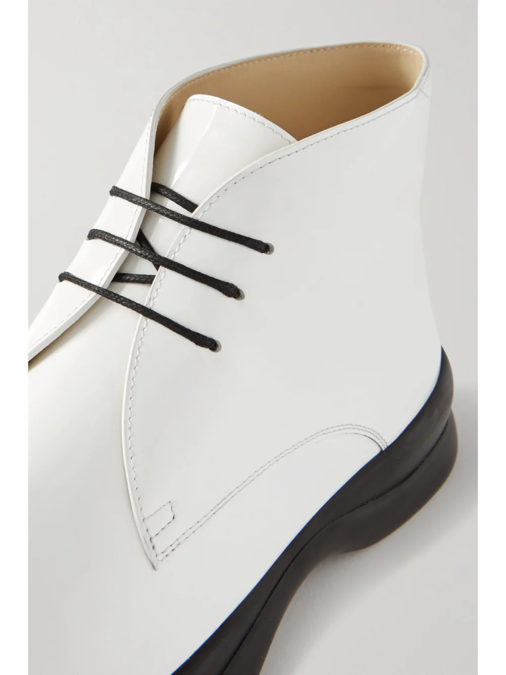 Close-up detail of The Row Town Lace Up Patent-leather Ankle Boots