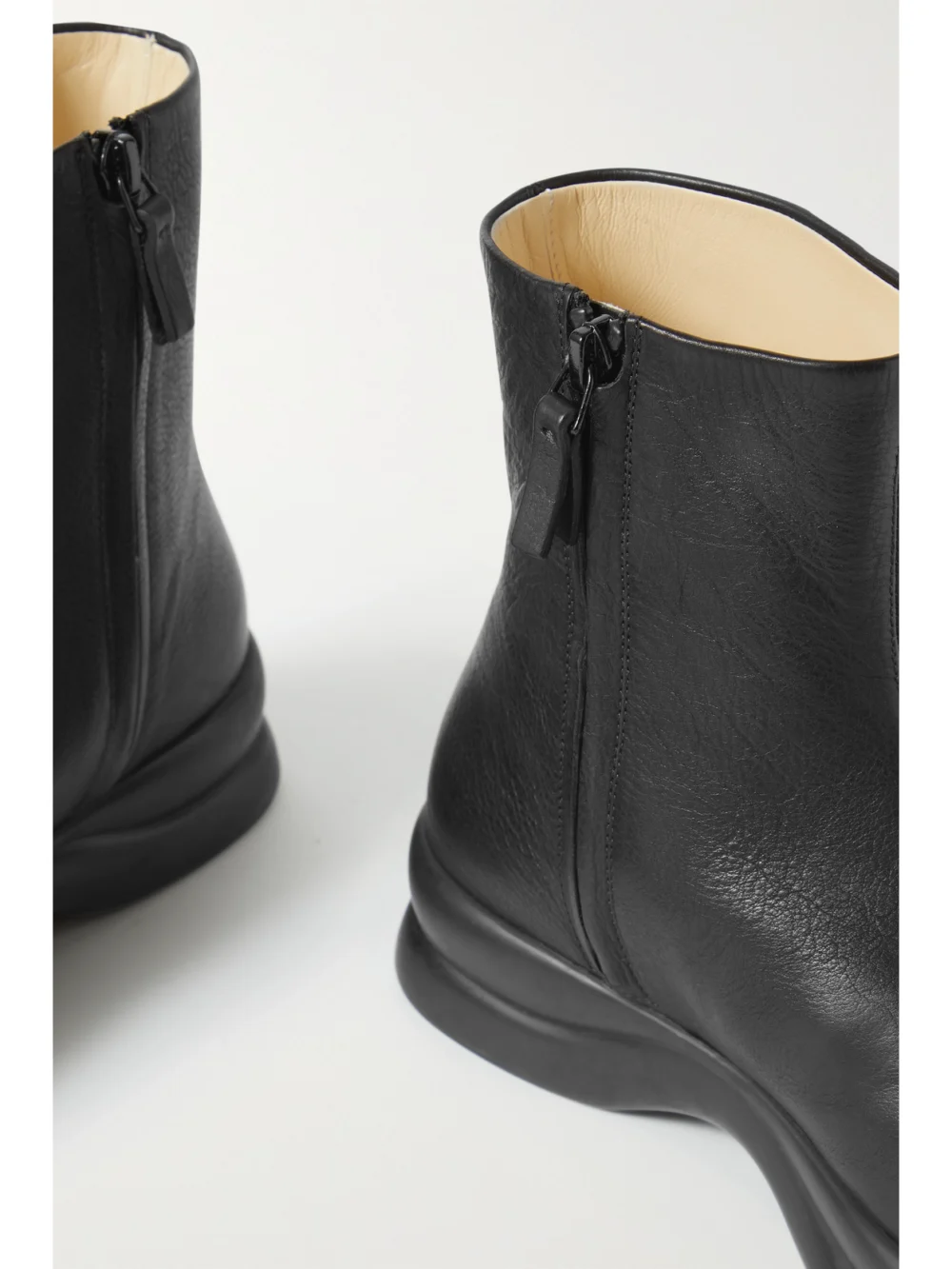 Close-up detail of The Row Town Leather Ankle Boots