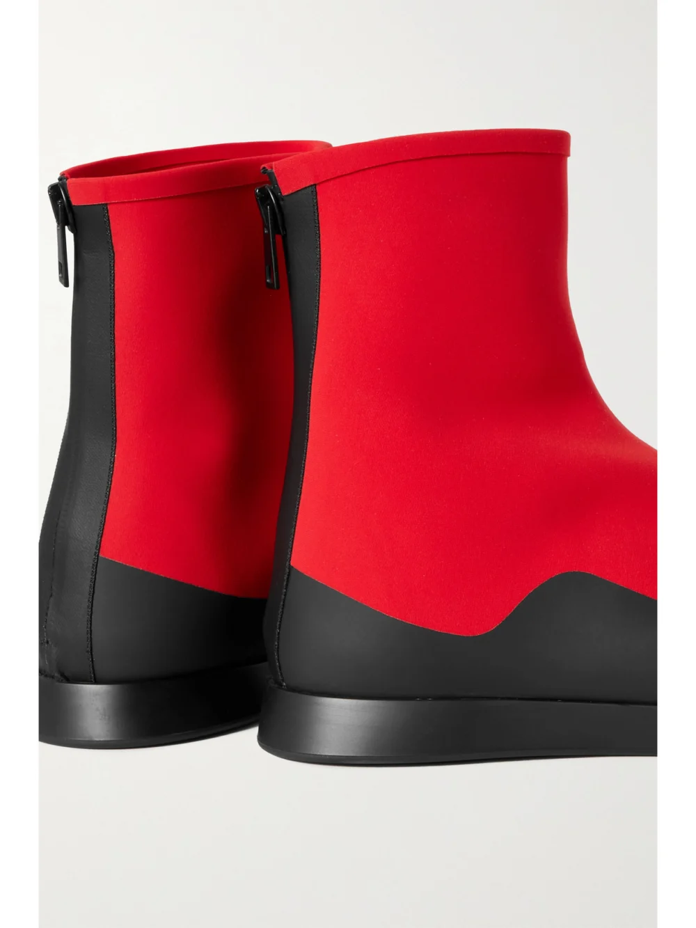 Close-up detail of The Row Tr Rubber-trimmed Scuba Ankle Boots