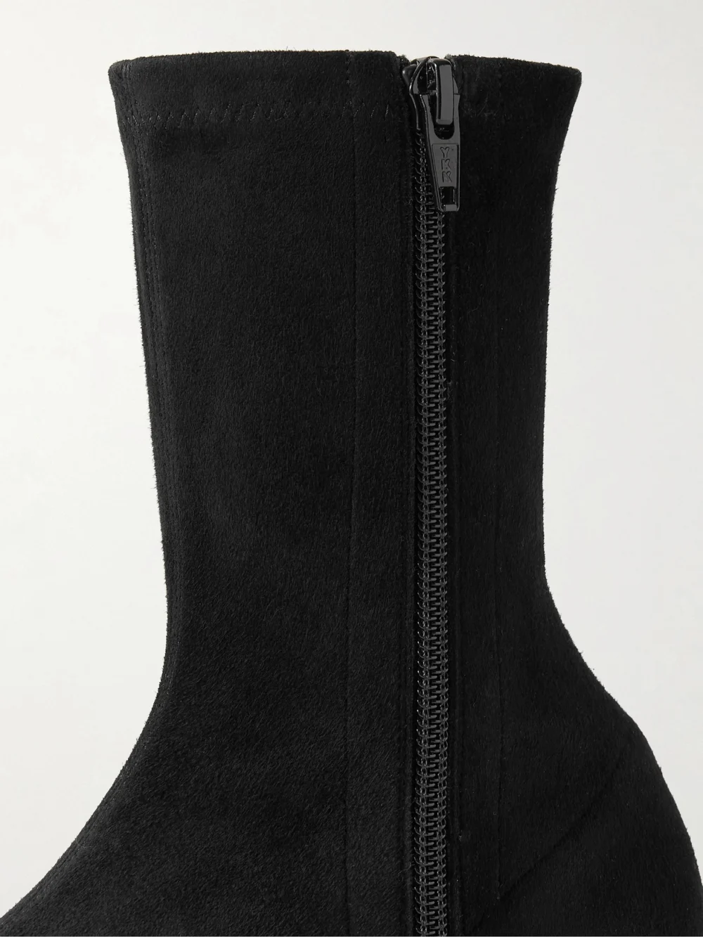 Close-up detail of The Row Uxor Suede Ankle Boots
