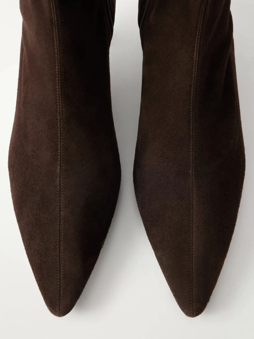 Close-up detail of The Row Uxor Suede Ankle Boots