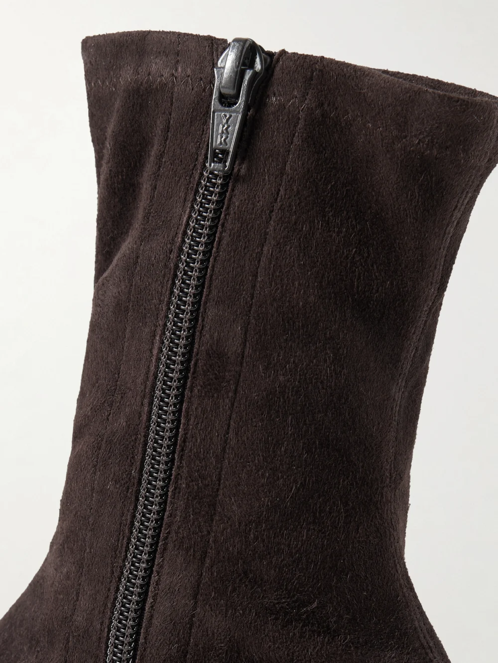 Close-up detail of The Row Uxor Suede Ankle Boots