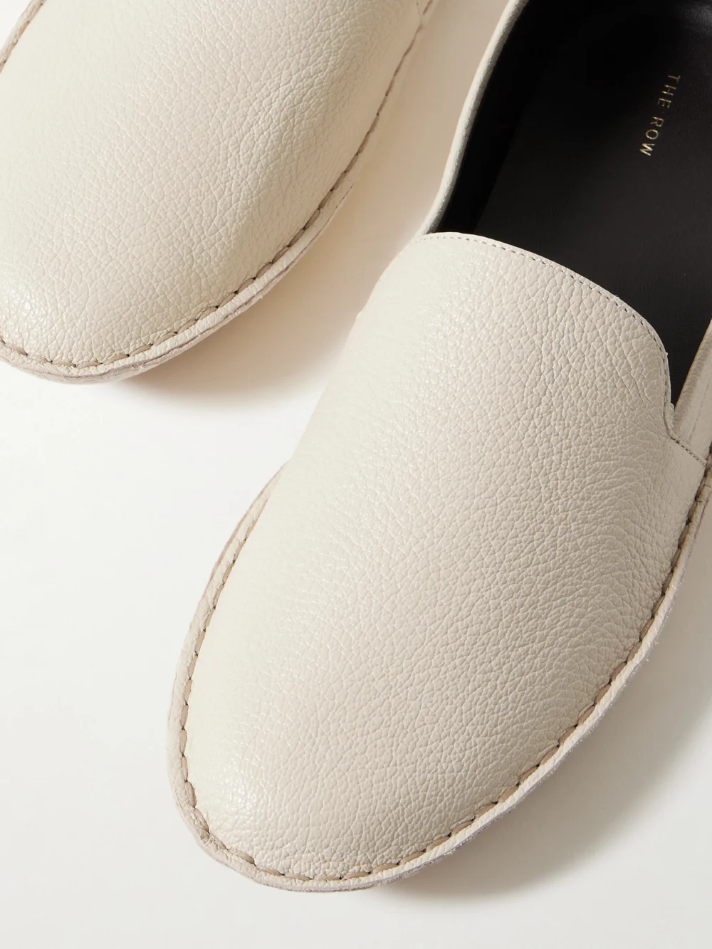 Close-up detail of The Row Vasko Textured-leather Loafers