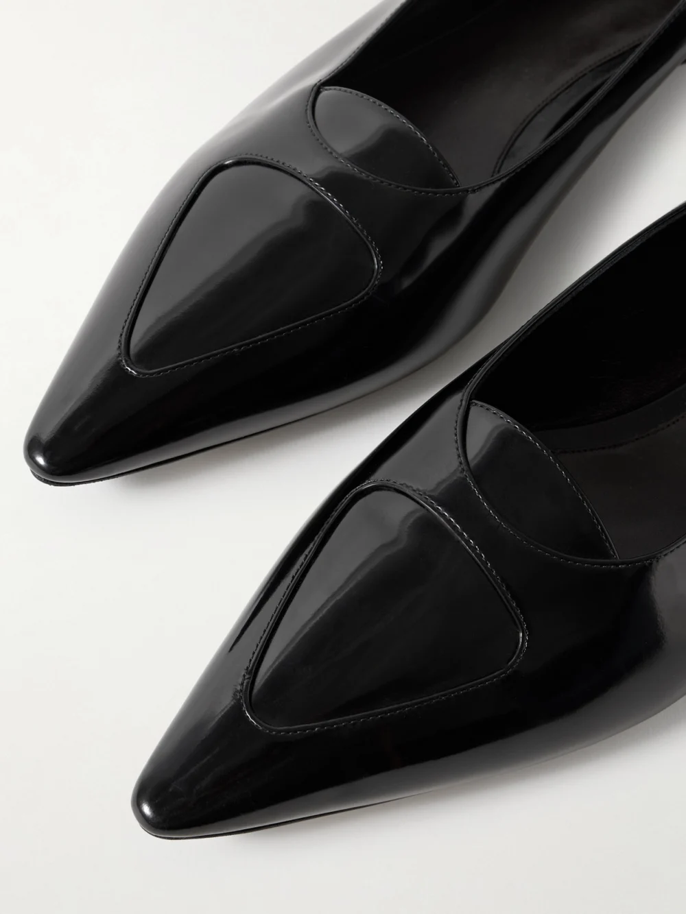 Close-up detail of The Row Viv Glossed-leather Ballet Flats