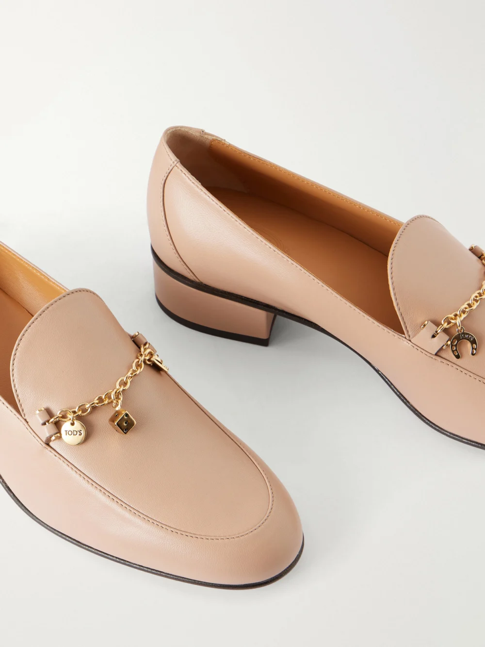 Close-up detail of the Tod's 23 Embellished Cuoio-leather Loafers