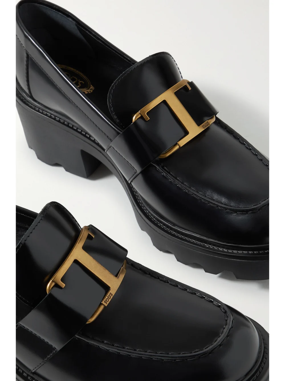 Close-up detail of the Tod's Embellished Leather Loafers