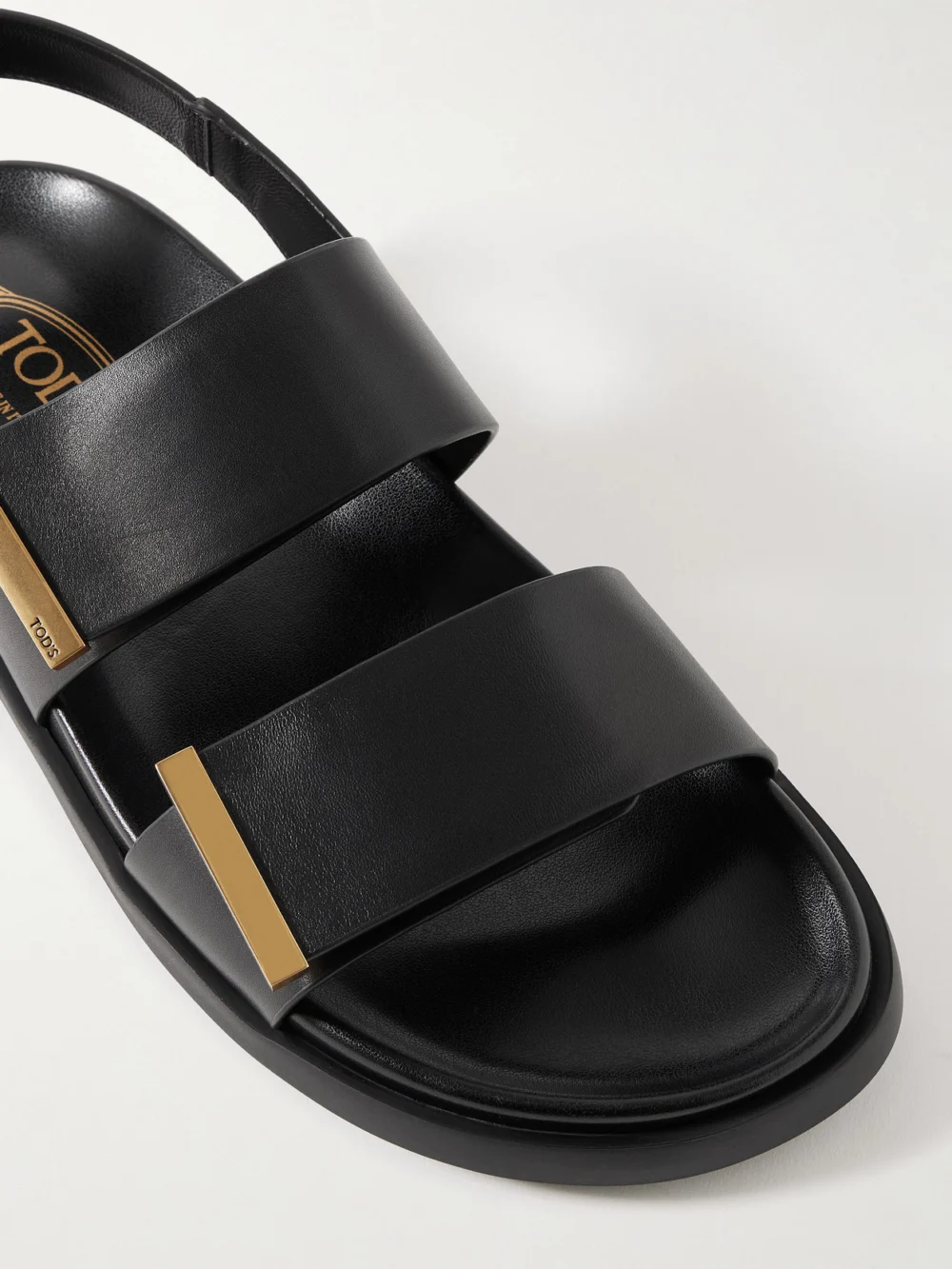 Close-up detail of the Tod's Embellished Leather Sandals