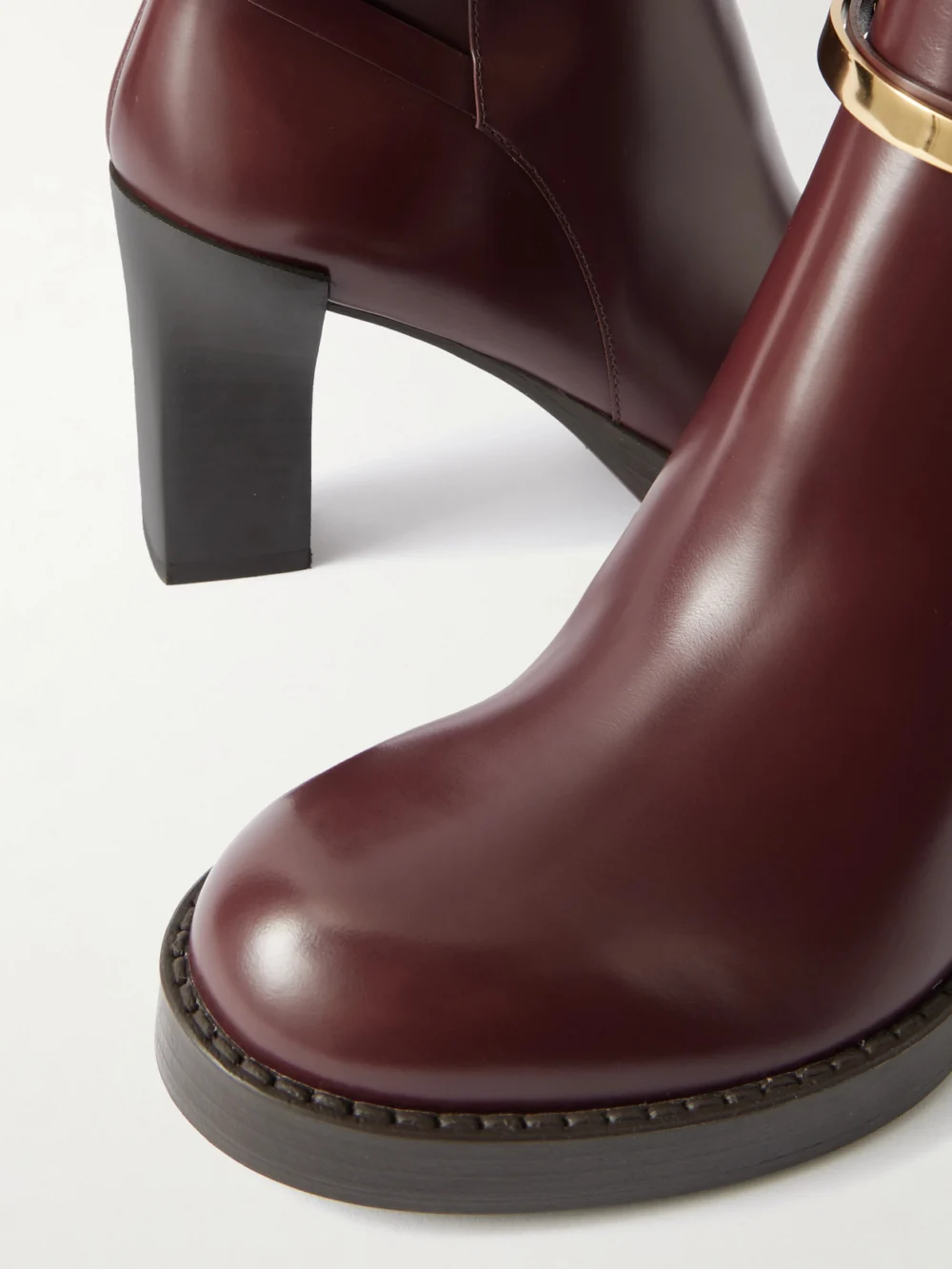 Close-up detail of the Tod's Gomma Embellished Glossed-leather Ankle Boots