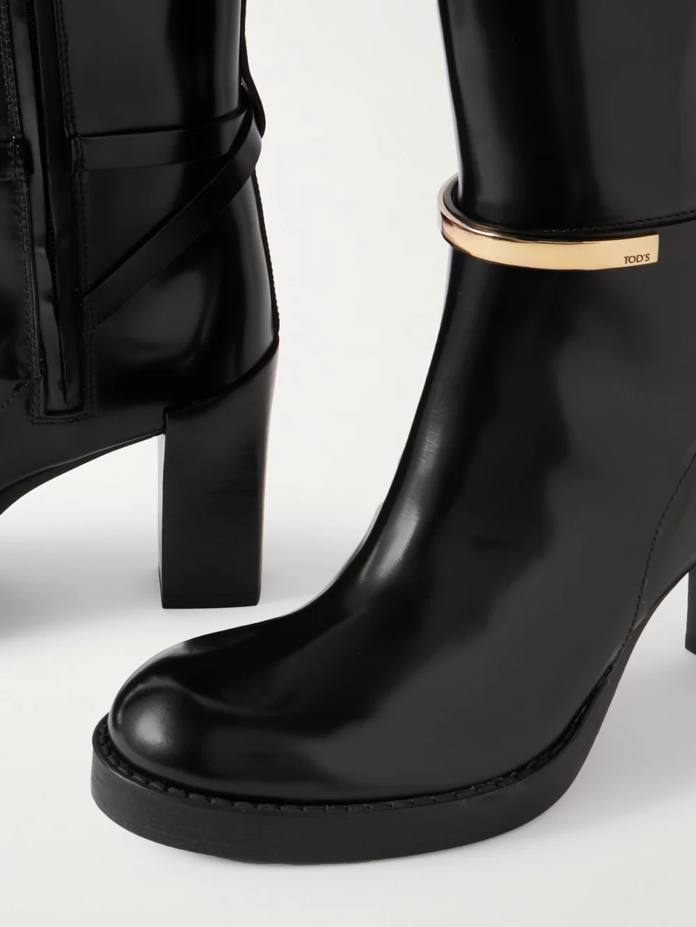 Close-up detail of the Tod's Gomma Embellished Leather Knee Boots