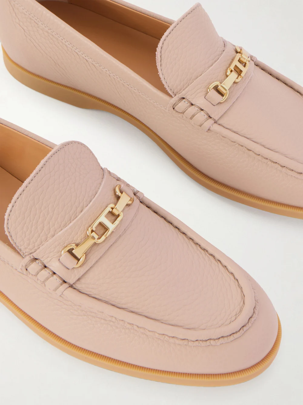 Close-up detail of the Tod's Gomma Embellished Textured-leather Loafers
