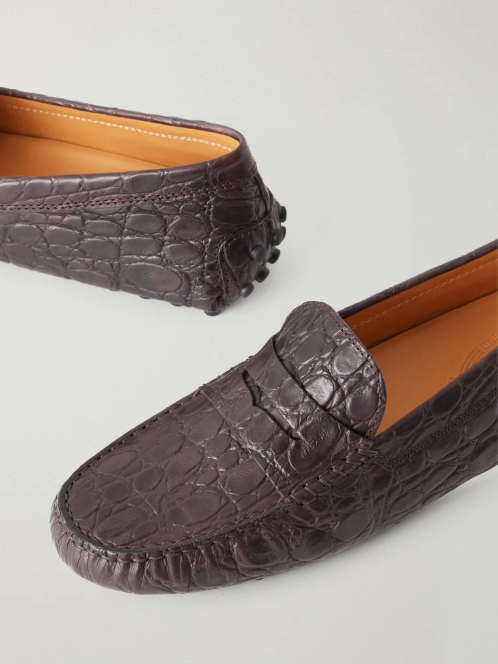 Close-up detail of the Tod's Gommino Croc-effect Leather Loafers