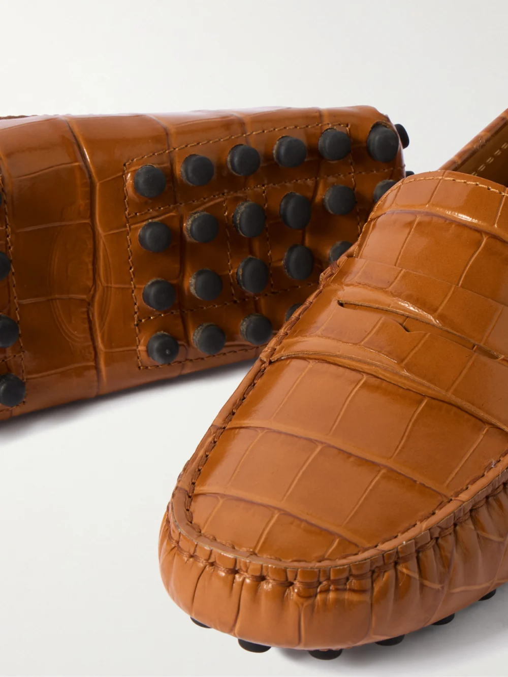 Close-up detail of the Tod's Gommino Croc-effect Leather Loafers