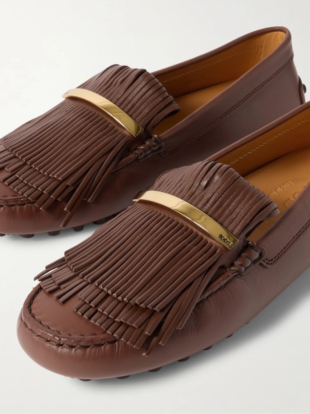 Close-up detail of the Tod's Gommino Embellished Fringed Leather Loafers