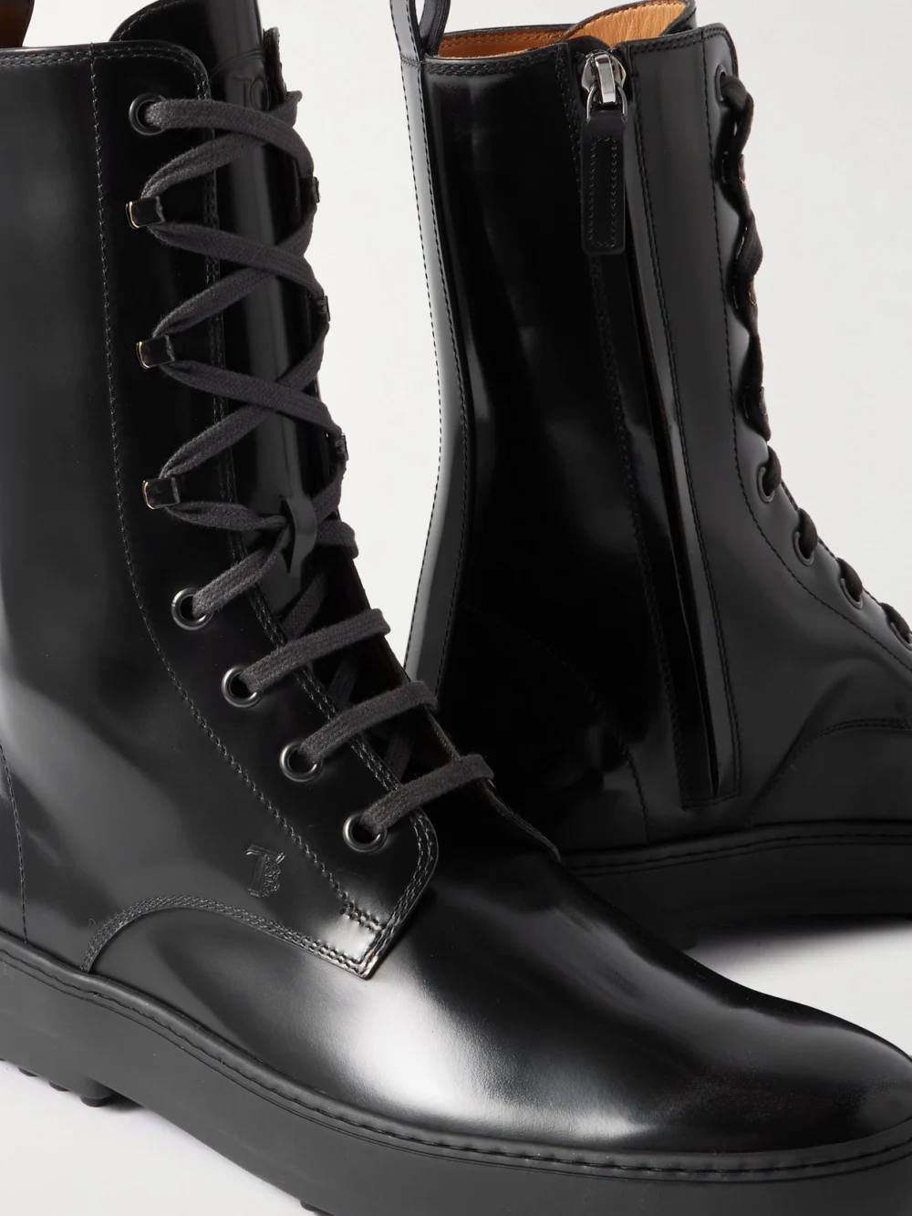 Close-up detail of the Tod's Gommino Glossed-leather Ankle Boots