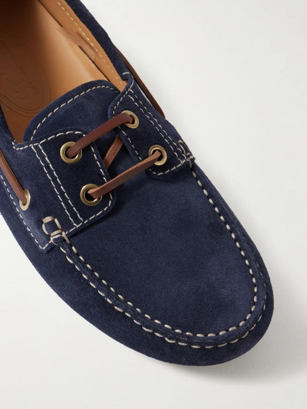 Close-up detail of the Tod's Gommino Macro Leather-trimmed Suede Loafers