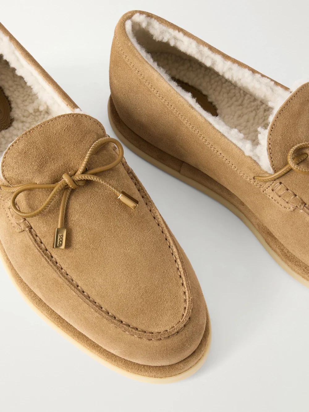 Close-up detail of the Tod's Gommino Shearling Suede Loafers