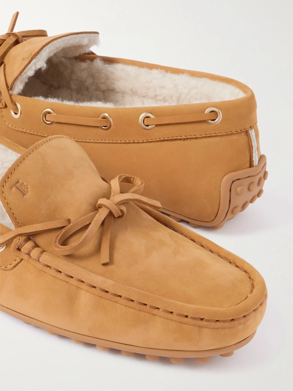 Close-up detail of the Tod's Gommino Shearling-trimmed Suede Loafers
