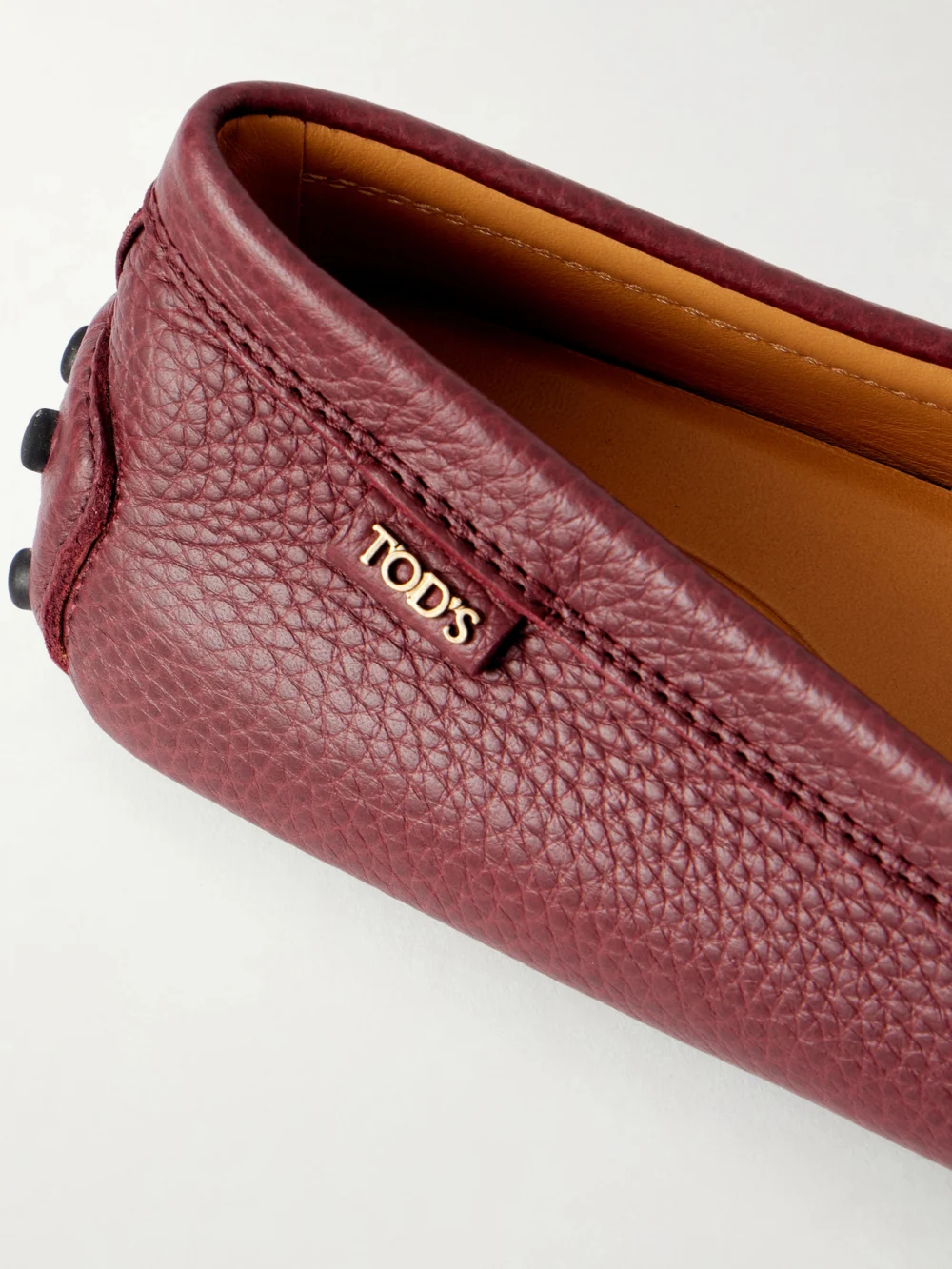 Close-up detail of the Tod's Gommino Textured-leather Loafers