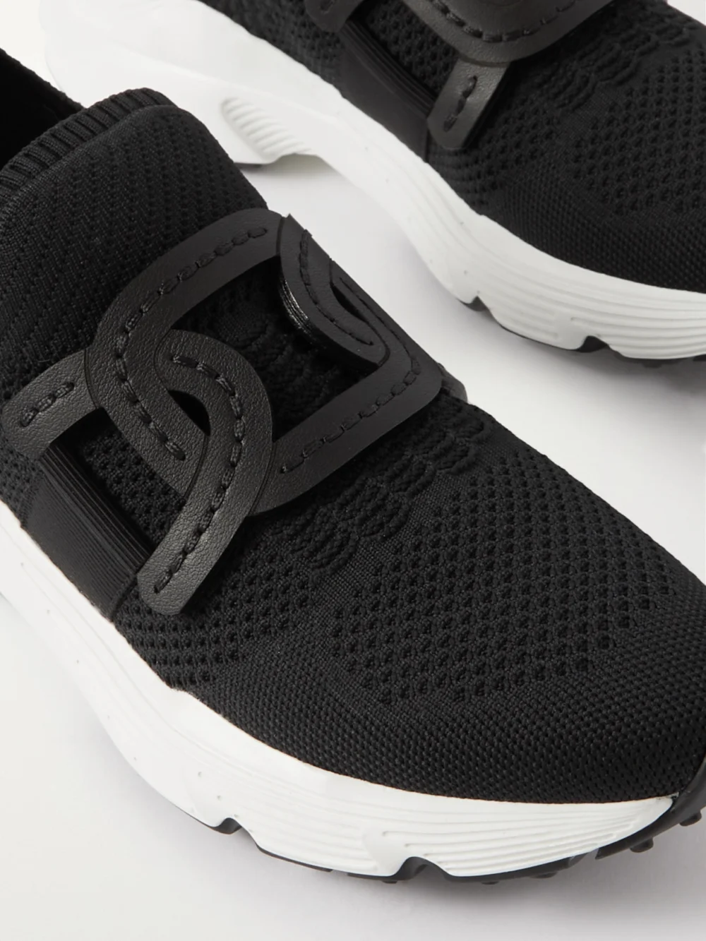 Close-up detail of the Tod's Leather-trimmed Stretch-knit Slip-on Sneakers