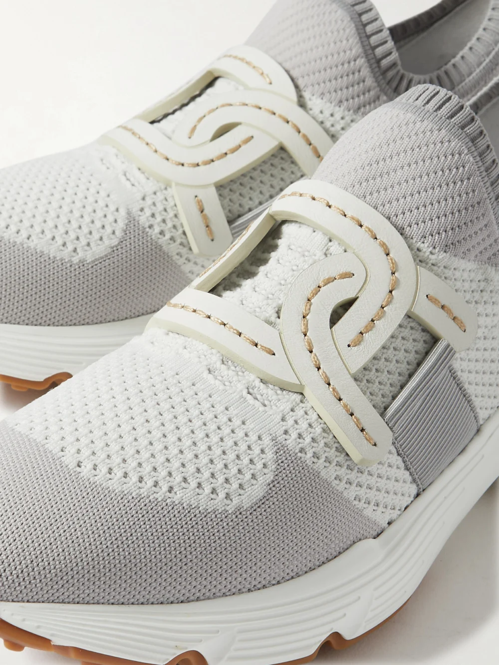 Close-up detail of the Tod's Leather-trimmed Stretch-knit Slip-on Sneakers