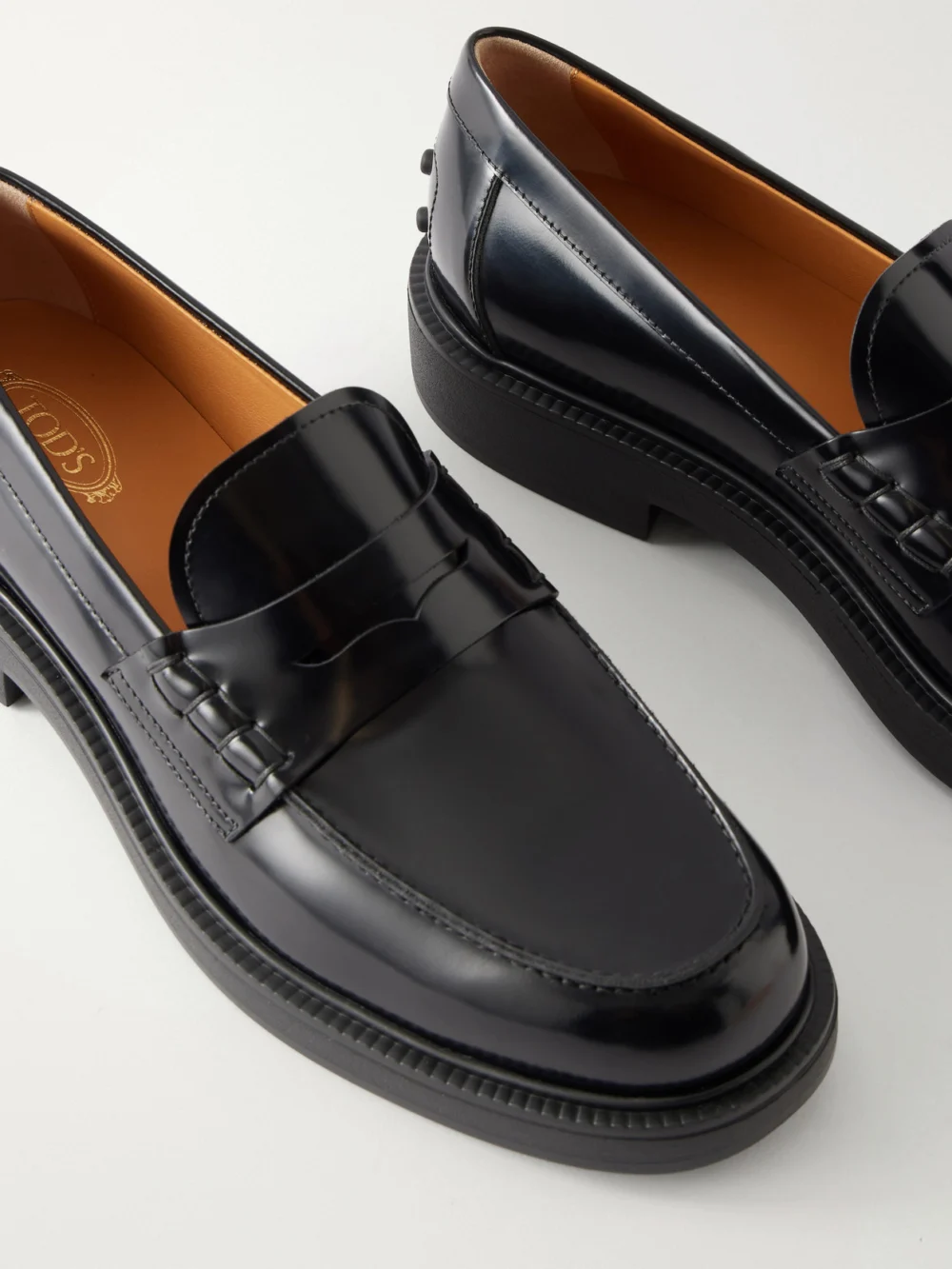 Close-up detail of the Tod's Logo-detailed Patent-leather Loafers