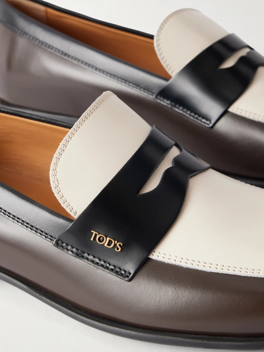 Close-up detail of the Tod's Logo-embossed Leather Loafers