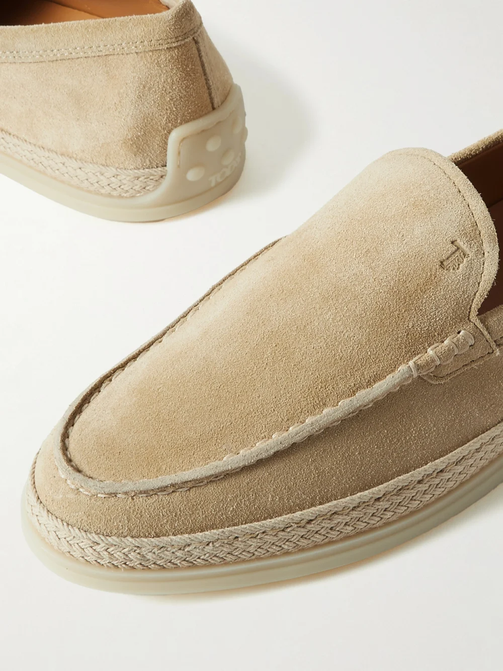 Close-up detail of the Tod's Raffia-trimmed Suede Loafers
