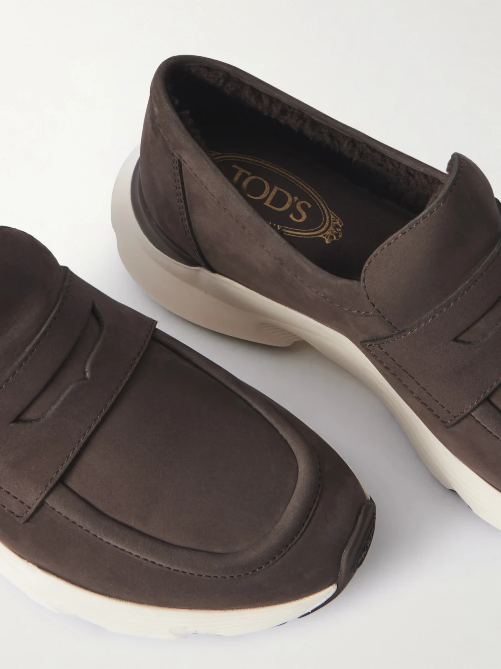 Close-up detail of the Tod's Shearling-lined Suede Loafers