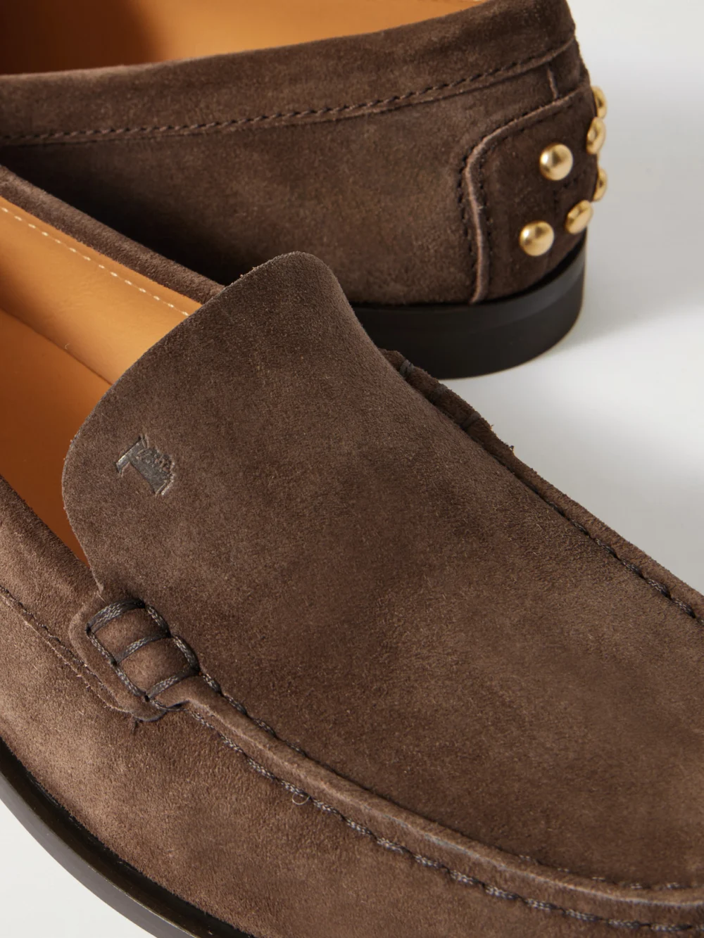 Close-up detail of the Tod's Studded Suede Loafers
