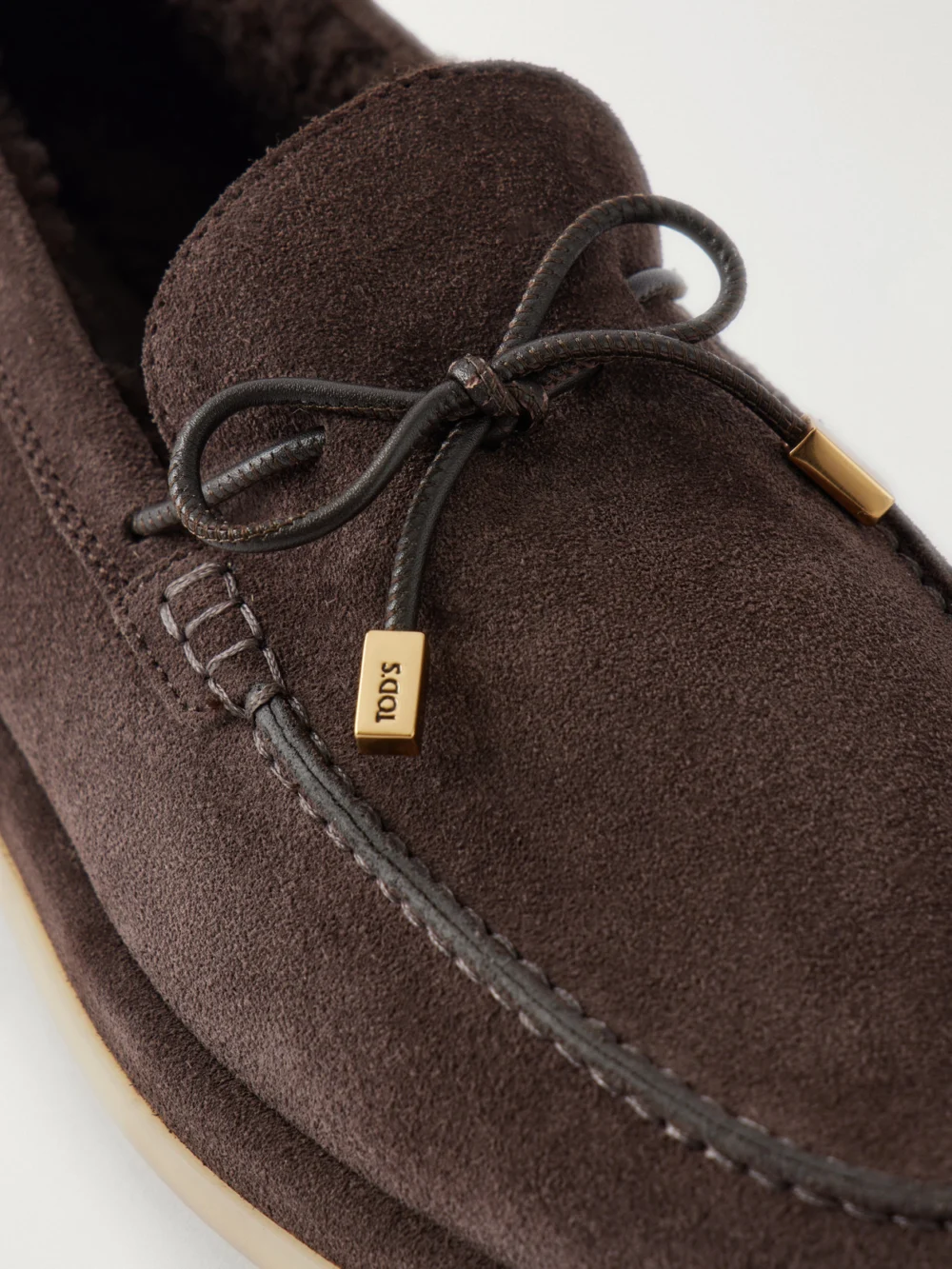 Close-up detail of the Tod's Suede Lace-up Loafers