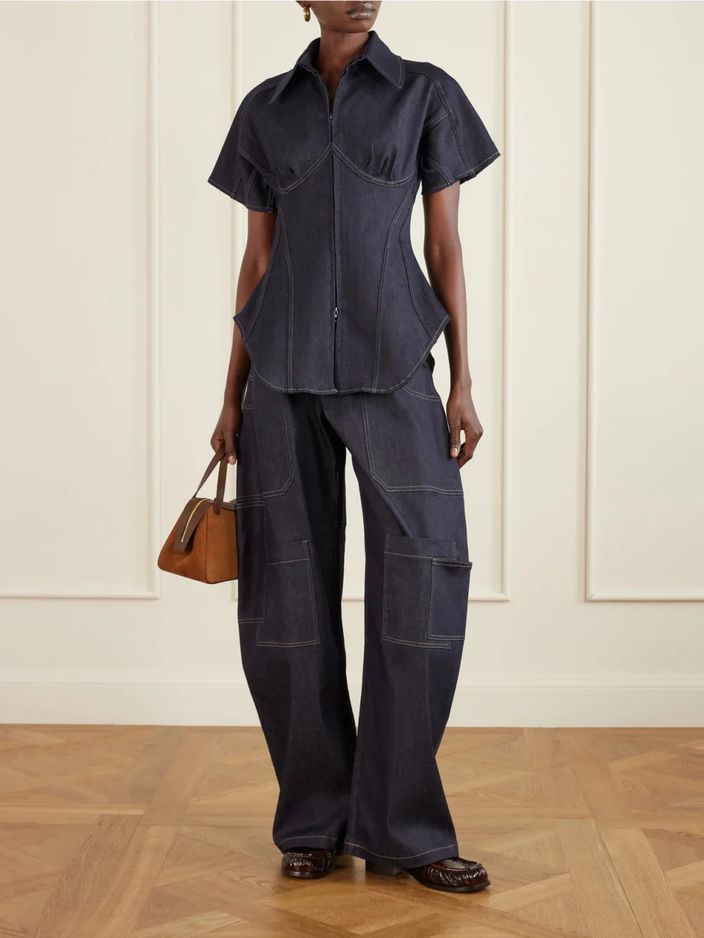 Tolu Coker Banana Cutout High-rise Barrel-leg Jeans, worn by a model