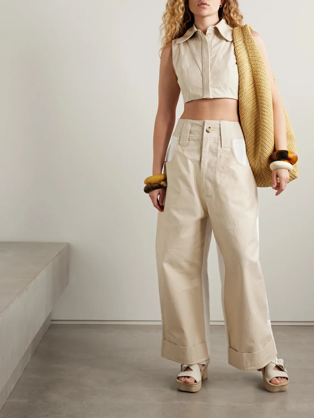 Tolu Coker Cropped Paneled Herringbone Cotton Top, worn by a model