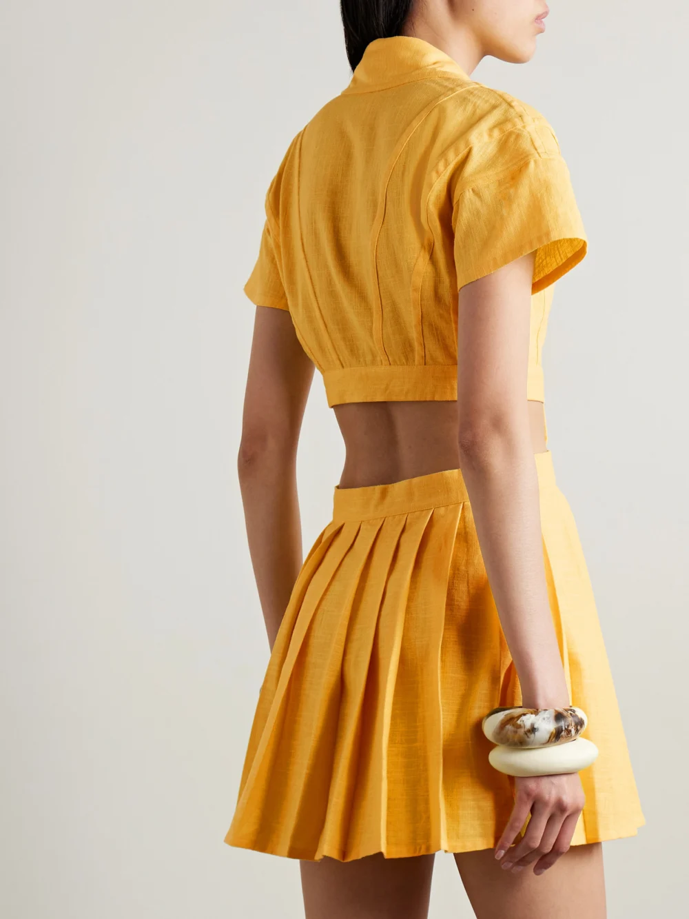 Back view of the Tolu Coker Cutout Pleated Ramie Mini Shirt Dress