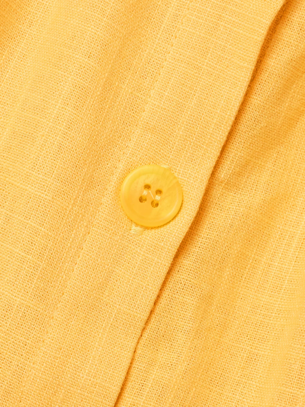 Close-up detail of the Tolu Coker Cutout Pleated Ramie Mini Shirt Dress