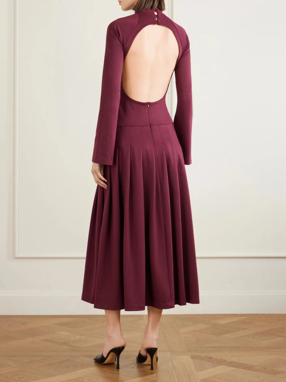 Back view of the Tolu Coker Open-back Cutout Pleated Jersey Turtleneck Midi Dress
